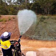 Closeup of Spray Grass Australia spraying hydroseeding mixture from cannons on customised HydroRig